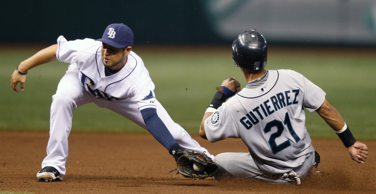 Franklin Gutierrez of the Mariners steals second base in the fourth inning as Tampa Bay’s Jason Bartlett is late with the tag.  (Associated Press / The Spokesman-Review)