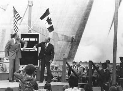 
The Libby Dam towers behind President Ford and Canada's energy minister, Donald S. MacDonald, as they jointly pull the switch to send energy through the dam's system on Aug. 24, 1975.
 (Spokesman-Review photo archive / The Spokesman-Review)