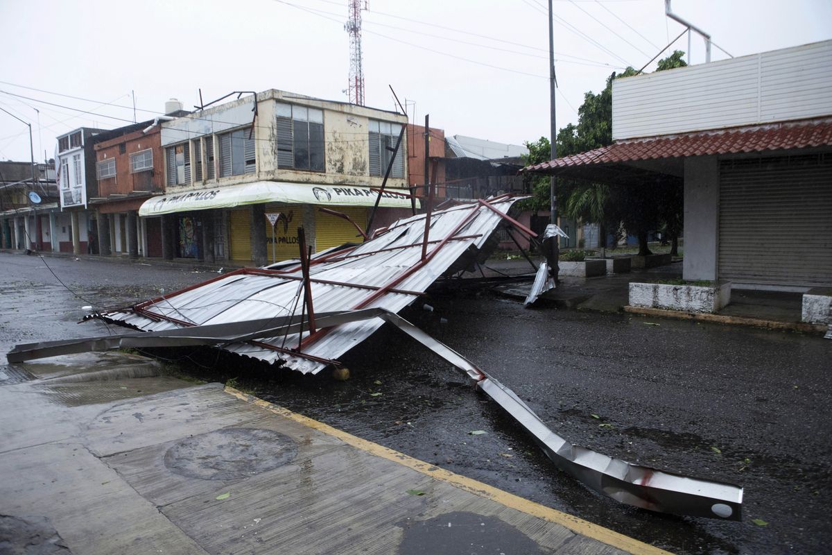 A fallen structure blocks a street after the passing of Hurricane Rick in Lazaro Cardenas, Mexico, Monday, Oct. 25, 2021. Hurricane Rick roared ashore along Mexico