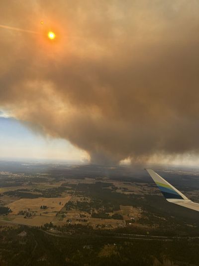 Airline passenger Kristen Baker shared this photo of the Gray Fire around Medical Lake that she photographed as her plane landed in Spokane Friday, Aug. 18, 2023.  (Jesse Tinsley/THE SPOKESMAN-REVIEW)
