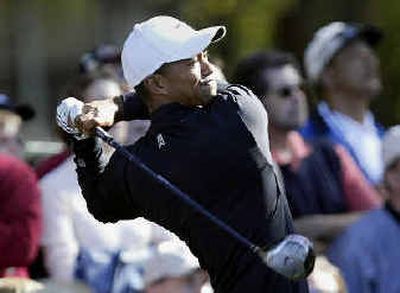 
Tiger Woods puts himself in place to win first stroke-play tournament in 19 tries. 
 (Associated Press / The Spokesman-Review)