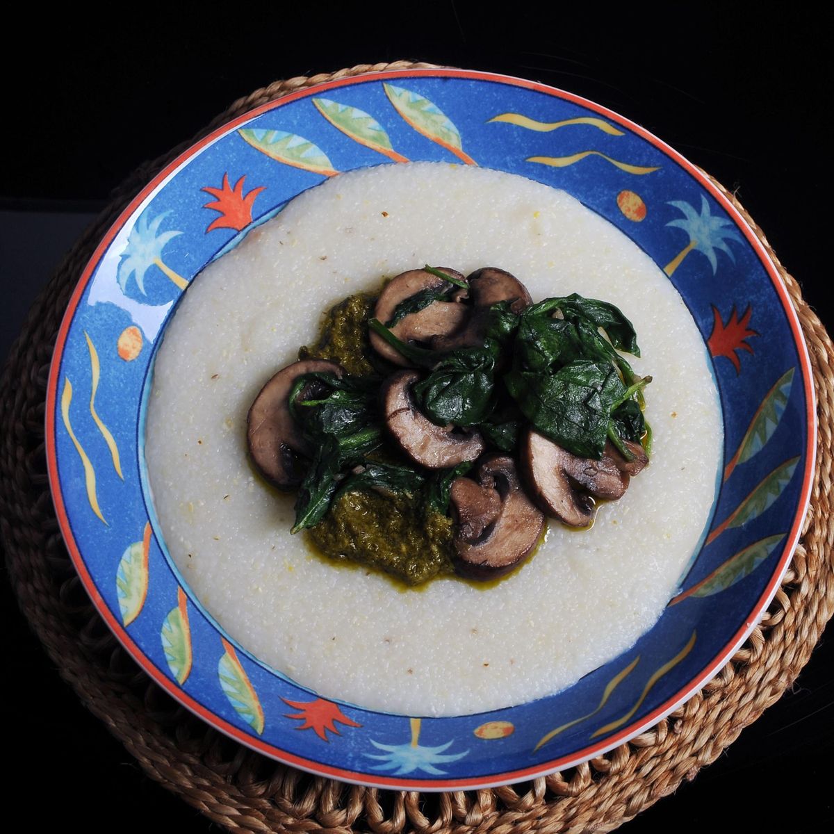 Grits with pesto, baby bella mushrooms and spinach. (Nate Guidry / Pittsburgh Post-Gazette)