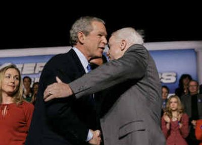 
President Bush and Sen. John McCain, R-Ariz., embrace as they wrap up two days in Western states together promoting Social Security reforms at Kiva Auditorium on Tuesday in Albuquerque, N.M. 
 (Associated Press / The Spokesman-Review)