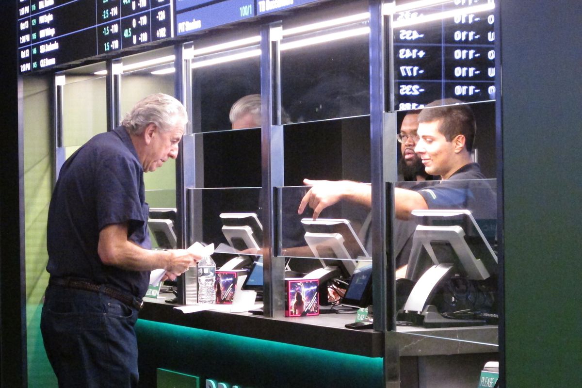 A man makes a sports wager in October 2019 at Resorts Casino in Atlantic City, N.J. Sports books say the blitz of advertising they launched in the run-up to last month’s Super Bowl, while costly, paid off in terms of attracting new customers to the fast-growing legal sports betting industry in the U.S.  (Wayne Parry)