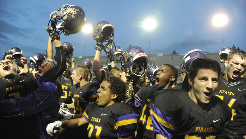 Rogers players celebrate a win against West Valley, Thursday, Sept. 17, 2015 at Joe Albi Stadium. Rogers won 21-20 over West Valley. (Jesse Tinsley / The Spokesman-Review)