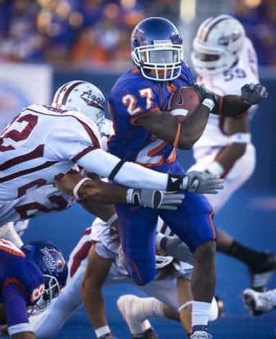 
Boise State's Jeremy Avery (27) rushes past NMSU's Derrick Richardson on Sunday.Associated Press
 (Associated Press / The Spokesman-Review)