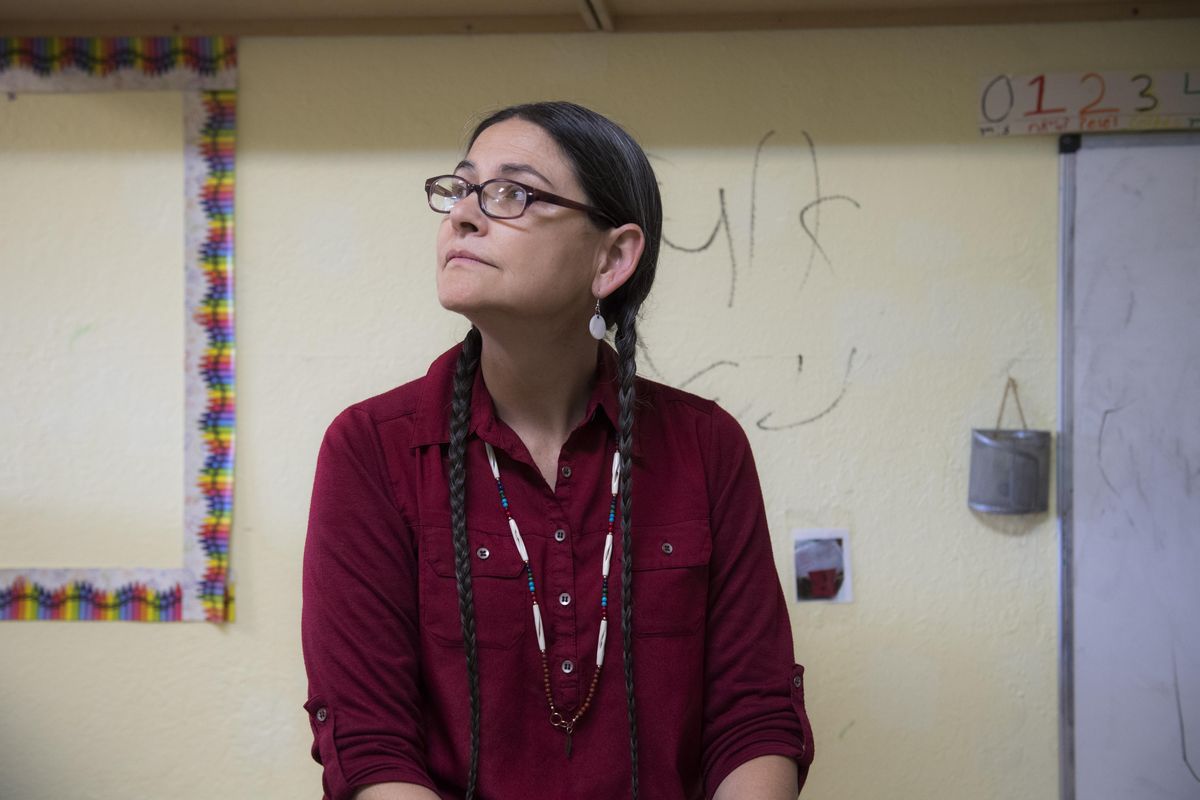 LaRae Wiley, Salish School of Spokane executive director, sits in front of racist graffiti against Native Americans written on the wall of an ECEAP room, Friday, May 5, 2017. The vandalism occurred at night on May 4. (Dan Pelle / The Spokesman-Review)