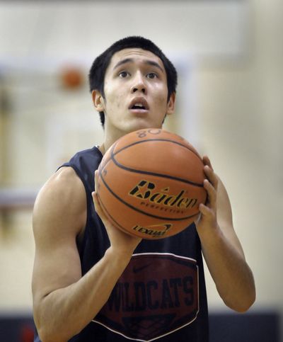 Mt. Spokane senior Chaz Johnson lines up a shot during a shooting drill. (CHRISTOPHER ANDERSON / The Spokesman-Review)