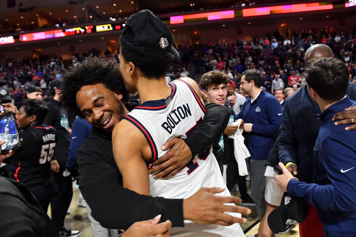 Ray Bolton embraces his son, Gonzaga Bulldogs guard Rasir Bolton (45), after GU’s 2022 defeat of the St. Mary