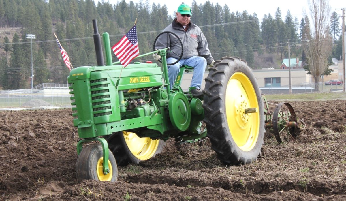 Chris Aman and other members of the Inland Empire Steam and Gas Buffs club volunteered their time and tractors to plow the field at the East Valley Community Garden.
 (Courtesy of East Valley School District)