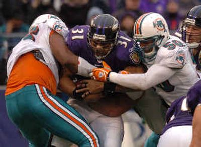 
Baltimore tailback Jamal Lewis has bulked up by lifting weights in prison. His four-month stay will end next week, then he must fulfill a two-month term at a halfway house.
 (Associated Press / The Spokesman-Review)