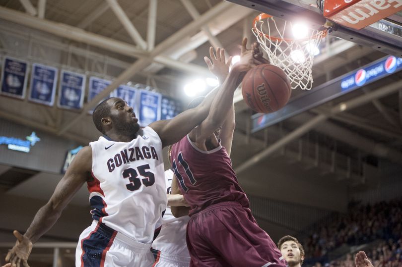 Gonzaga's Sam Dower Jr. (35) blocks a rebound out of the hands of LMU's Nick Stover (11) during a college basketball game on Saturday, February 15, 2014, at McCarthey Athletic Center in Spokane, Wash. (Tyler Tjomsland / The Spokesman-Review)