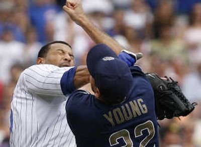 
Chicago's Derrek Lee, left, dukes it out with San Diego pitcher Chris Young. Associated Press
 (Associated Press / The Spokesman-Review)
