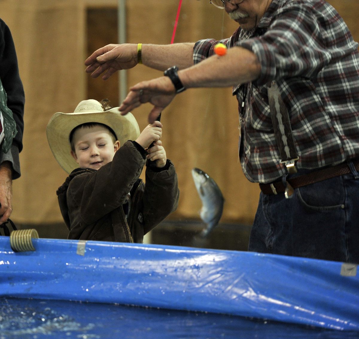 Travis Hendren, 5, of Athol, Idaho, hauls in a rainbow trout at the 2012 Big Horn Outdoor Adventure Show. (Dan Pelle)