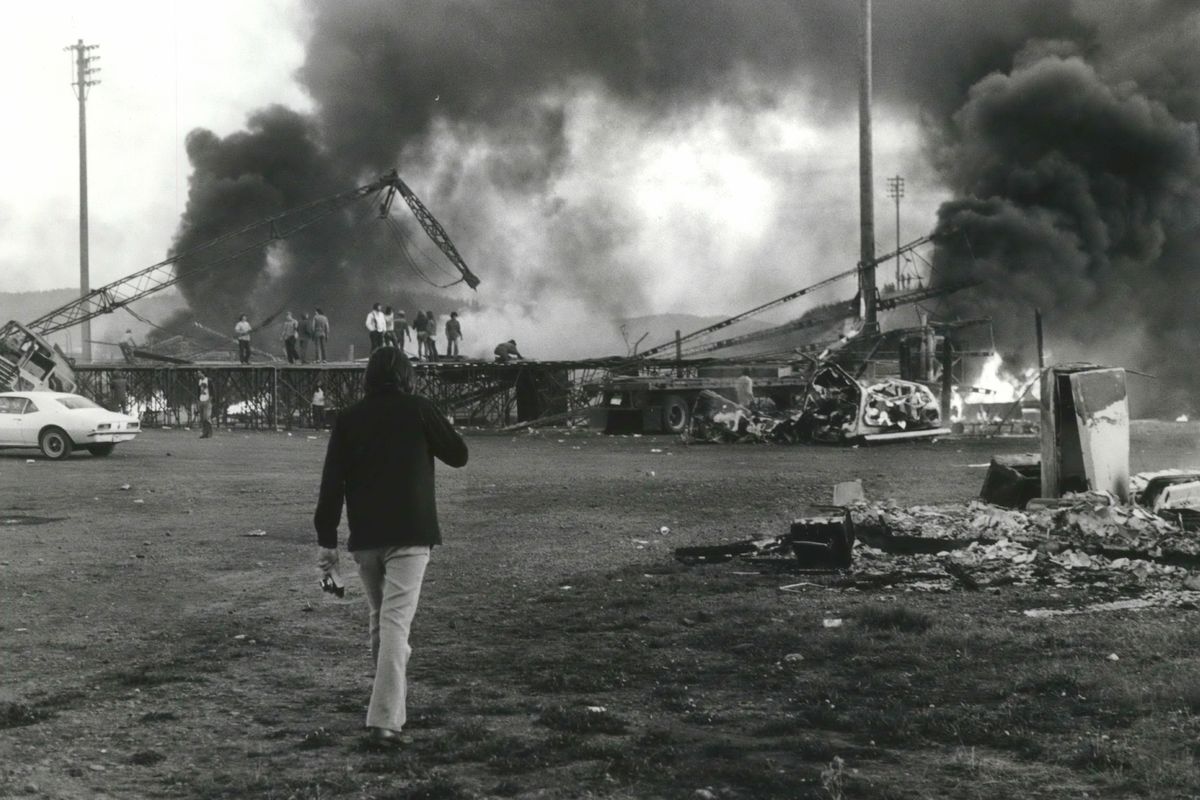 In this 1976 photo, fire breaks out at the rock festival Nor’Wester ’76 at Stateline, Idaho.  (The Spokesman-Review photo archive)