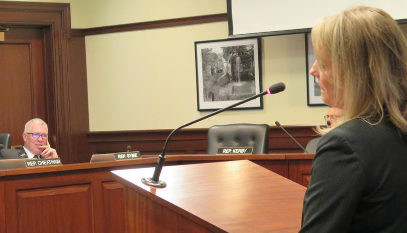 Rep. Scott Syme, R-Caldwell, listens as Idaho state schools Superintendent Sherri Ybarra, right, addresses the House Education Committee about school science standards on Wednesday, Feb. 7, 2018. (Betsy Z. Russell / SR)