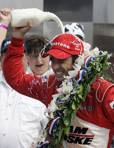 Associated Press Helio Castroneves douses himself with milk after winning the Indianapolis 500 on Sunday. (Associated Press / The Spokesman-Review)