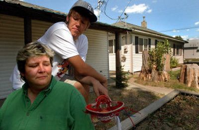 
Laura Bry, pictured in her Sandpoint front yard with son Will Knipe, is a small-business owner and single mother who rents a small house. She wants property tax relief because she fears soaring property taxes will push up rents in the future. 
 (Kathy Plonka / The Spokesman-Review)