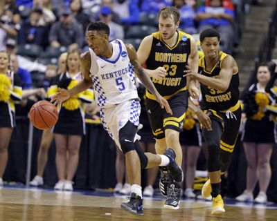 Kentucky guard Malik Monk (5) is chased by Northern Kentucky forward Carson Williams (23) and Northern Kentucky guard Dantez Walton (32) during the second half of a first-round game in the men's NCAA college basketball tournament in Indianapolis, Friday, March 17, 2017. Kentucky defeated Northern Kentucky 79-70. (Michael Conroy / Associated Press)