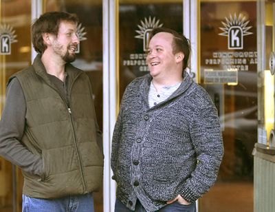 Gordon Mellot, right, and husband Rob Rhodes share a laugh in front of the Kenworthy Theater in Moscow, Idaho, on Nov. 4, 2017. (Kai Eiselein / Moscow-Pullman Daily News)