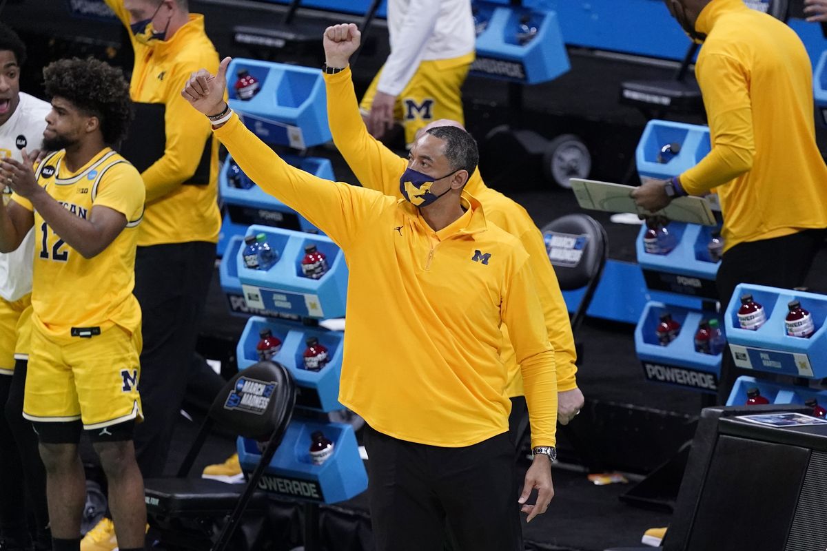Michigan head coach Juwan Howard celebrates at the end of a second-round game against LSU in the NCAA men