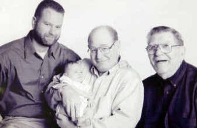 
Dan Hibbard, center, holds his grandson, Gavin, with his son Brad, left, and dad, Elton. 
 (Photos courtesy of family / The Spokesman-Review)