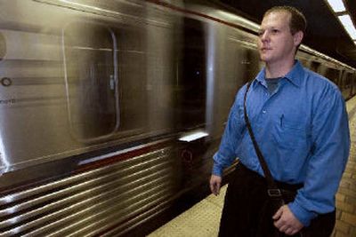 
Actor and part time waiter Greg Forshay rides the subway in Los Angeles Thursday. He's taking public transportation to save fuel. 
 (Associated Press / The Spokesman-Review)