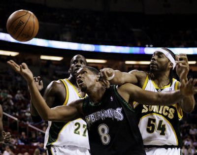
Sonics Chris Wilcox, left, and Johan Petro battle Ryan Gomes for a loose ball. Associated Press
 (Associated Press / The Spokesman-Review)