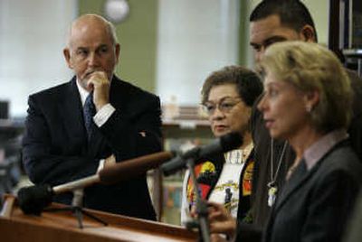Art Jarvis, left, of the Tacoma School District, listens as Gov. Chris Gregoire talks about schools Monday at Lincoln High School in Tacoma. Associated Press
(Associated Press / The Spokesman-Review)