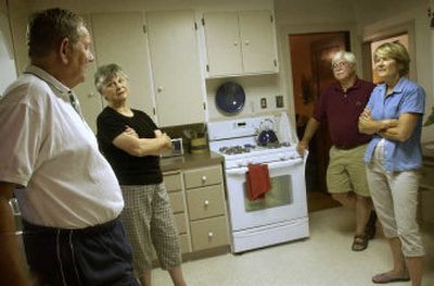 John and Gail Goeller, left, show Bill and Carol Evans of Rochester, N.Y., their South Hill home, which they are selling without the help of a real estate agent.
(Holly Pickett / The Spokesman-Review)