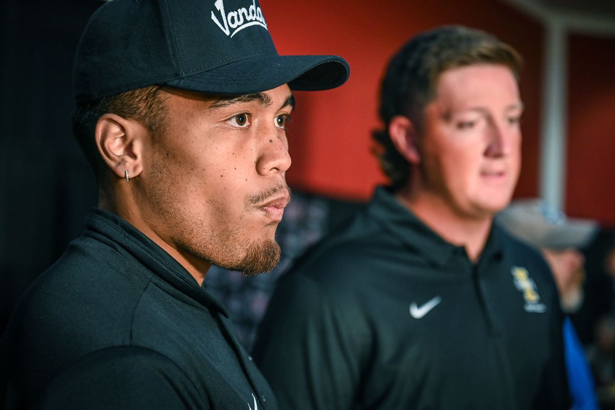 Idaho captains Fa’Avae Fa’Avae, left, and Logan Floyd answer questions during Big Sky media kickoff day in July at the Davenport Grand Hotel in Spokane. The two, along with fellow UI captains Nate DeGraw, Leo Tamba and Connor Whitney, are trying to help their teammates overcome the news that four of their fellow UI students were killed a week ago.   (Dan Pelle/The Spokesman-Review)