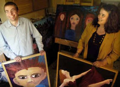 
Hans Haupt laughs while having his picture taken with his mom, Sandy Haupt in their home studio. Hans stands with his painting 