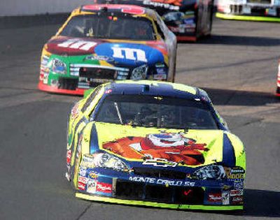 
Kyle Busch, foreground, leads Elliot Sadler en route to winning the NASCAR Nextel Cup Lenox Industrial Tools 300 auto race.
 (Associated Press / The Spokesman-Review)