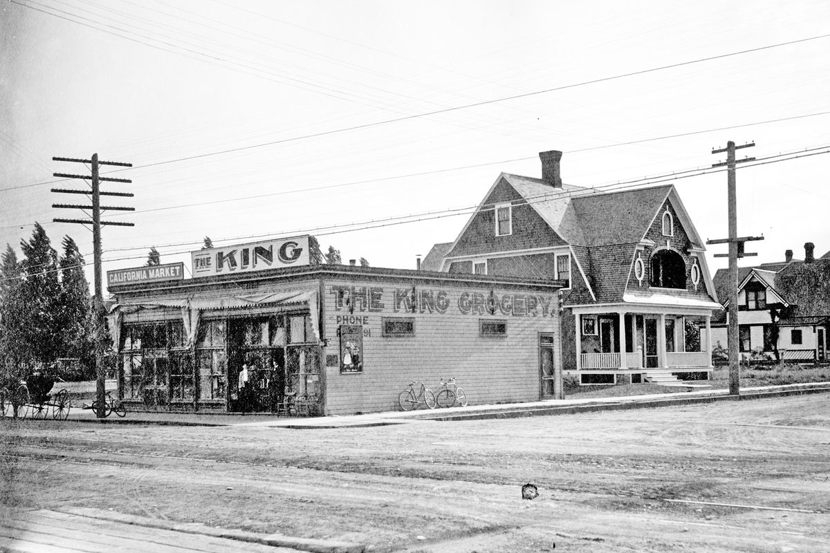 Early 1900s: Photo of the King Grocery, at the corner of Maxwell Avenue and Monroe Street in north Spokane. The store was owned by Joel Barnes King, a Spokane pioneer.