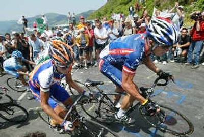 
Lance Armstrong, right, and Mickael Rasmussen of Denmark climb the Col du Puy Marie pass during the 10th stage.
 (Associated Press / The Spokesman-Review)