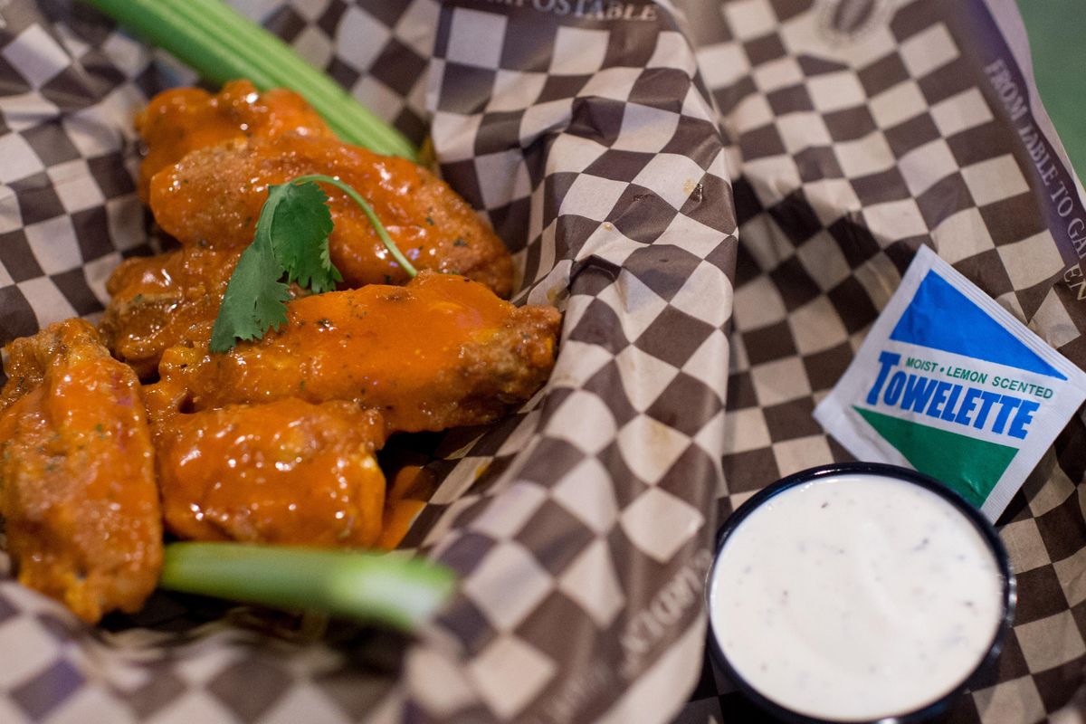 Chicken wings come with a wet nap at The Ref Sports Bar in Spokane Valley. (Tyler Tjomsland / The Spokesman-Review)
