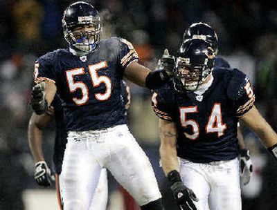 
Chicago's Lance Briggs and Brian Urlacher (54) host Carolina on Sunday.
 (Associated Press / The Spokesman-Review)