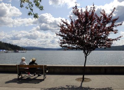 JoAnne and Wayne Van Gorder enjoy a low-key day at Lake Coeur d’Alene while the Coeur d’Alene Symphony Orchestra  plays in nearby City Park.  (J. BART RAYNIAK / The Spokesman-Review)