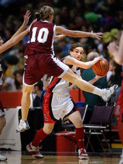 
Liberty's Shawn Hennessey looks to pass against Laney Brown of Waterville, which won 48-32.
 (Brian Plonka / The Spokesman-Review)