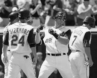 
Indians' Travis Hafner (48) touches the plate after his first-inning grand slam.
 (Associated Press / The Spokesman-Review)