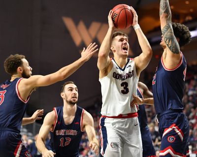 Forward Filip Petrusev battles inside against Saint Mary’s defenders during Gonzaga’s 84-66 win in the 2020 WCC Tournament championship game at Orleans Arena in Las Vegas.  (Tyler Tjomsland/The Spokesman-Review)