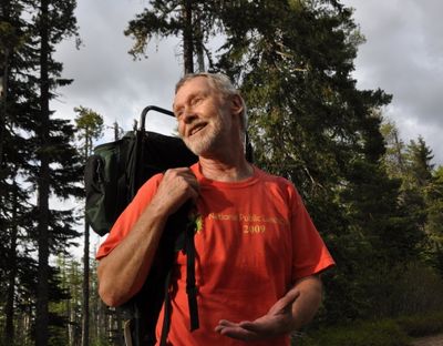 Lynn Smith of Coeur d'Alene has led Spokane Mountaineers Wednesday-evening hikes for years, often wearing a frame pack with an open top. He encourages others joining him on the treks to pick up litter and fill up his pack as they go. (Rich Landers)