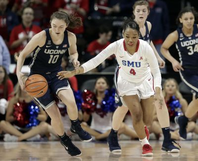 Connecticut guard Molly Bent (10) steals the ball away from SMU guard Mikayla Reese (4) during Saturday’s game. UConn won 80-36. (Tony Gutierrez / Associated Press)