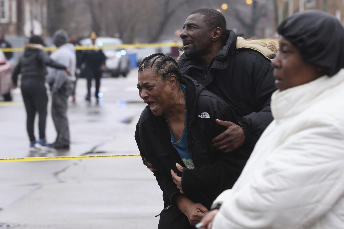 In this March 30, 2017,  photo, Georgia Jackson, 72, is overcome with emotion after learning that her two grandsons were found fatally shot in Chicago