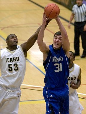 ORG XMIT: IDMOS101 Drake forward Jonathon Cox (31) grabs a rebound in front of Idaho center Marvin Jefferson (53) and guard Kashif Watson, right, during the first half of an NCAA college basketball game in the first round of the College Insider.com Postseason Tournament (CIT) Wednesday, March 18, 2009 at Memorial Gym in Moscow, Idaho. Idaho won 69-67. (AP Photo/Moscow-Pullman Daily News, Dean Hare) (Dean Hare / The Spokesman-Review)