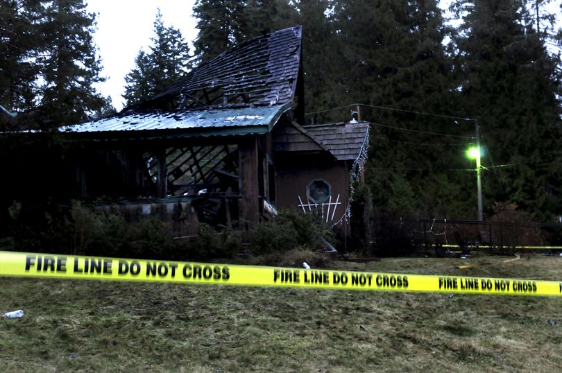 Police tape surrounded The Chef in the Forest restaurant early Monday morning December 21, 2009, after a fire destroyed the building at Hauser Lake late Sunday night. (Kathy Plonka)