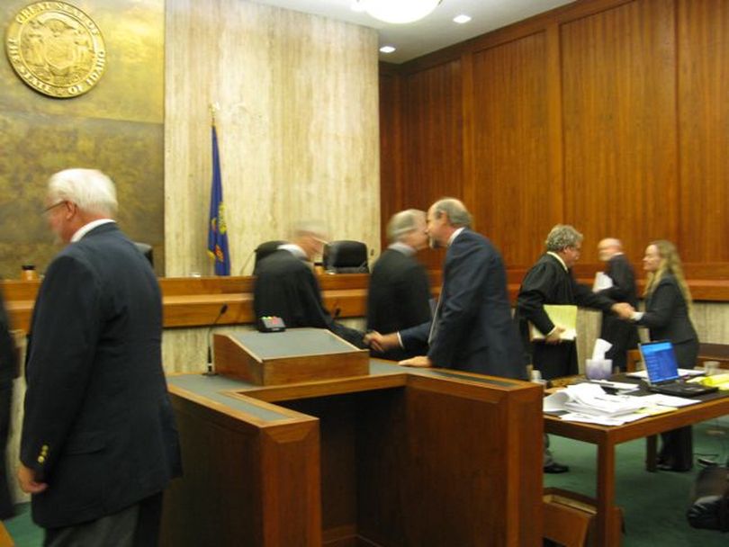 Idaho Supreme Court justices shake hands with attorneys on both sides after oral arguments Friday morning in the Highway 12 mega-loads truck shipments case. The justices took the case under advisement. (Betsy Russell)