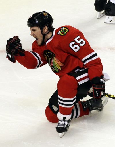Chicago’s Andrew Shaw celebrates after scoring one of the Blackhawks’ four goals in the third period. (Associated Press)