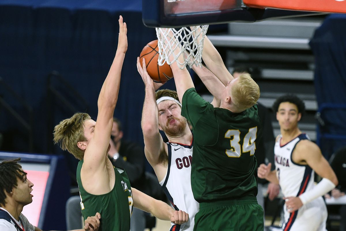 Gonzaga forward Drew Timme (2) struggles to line up a shot as San Francisco center Jonas Visser (31) and San Francisco forward Taavi Jurkatamm (34) defend during the first half of an NCAA college basketball game, Sat., Jan. 2, 2021, in the McCarthey Athletic Center.  (Colin Mulvany/THE SPOKESMAN-REVIEW)