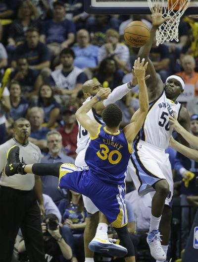 Golden State’s Stephen Curry shoots over Zach Randolph (50). (Associated Press)